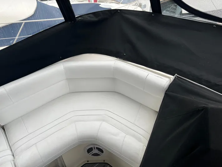 Low Engine Hours Yacht Photos Pics 1995 Cruisers Yachts 3650 ACMY interior with white seating and black trim.