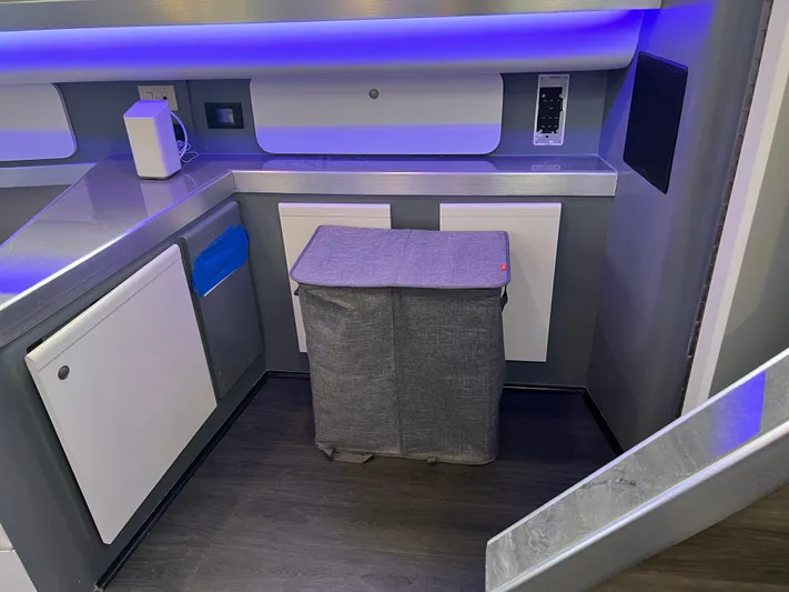 Low Engine Hours Yacht Photos Pics Modern interior of 1995 Cruisers Yachts 3650 ACMY with sleek cabinetry and ambient lighting.