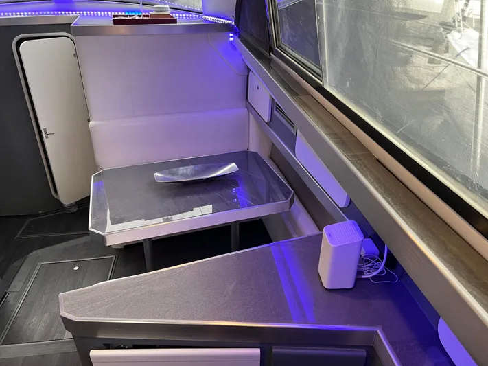 Low Engine Hours Yacht Photos Pics Interior of 1995 Cruisers Yachts 3650 ACMY with modern seating and ambient lighting.