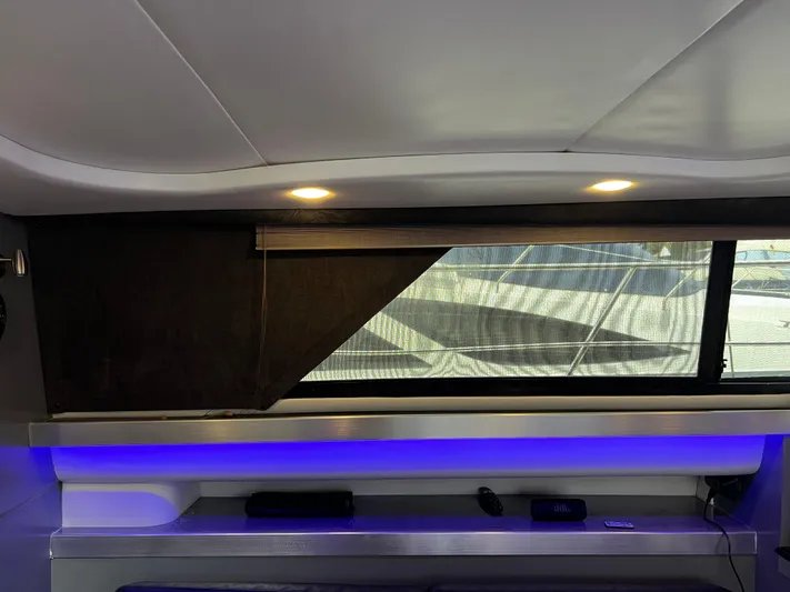 Low Engine Hours Yacht Photos Pics Interior of 1995 Cruisers Yachts 3650 ACMY with modern lighting and window view.