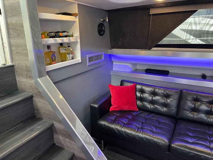 Low Engine Hours Yacht Photos Pics Luxurious interior of 1995 Cruisers Yachts 3650 ACMY with leather seating and ambient lighting.