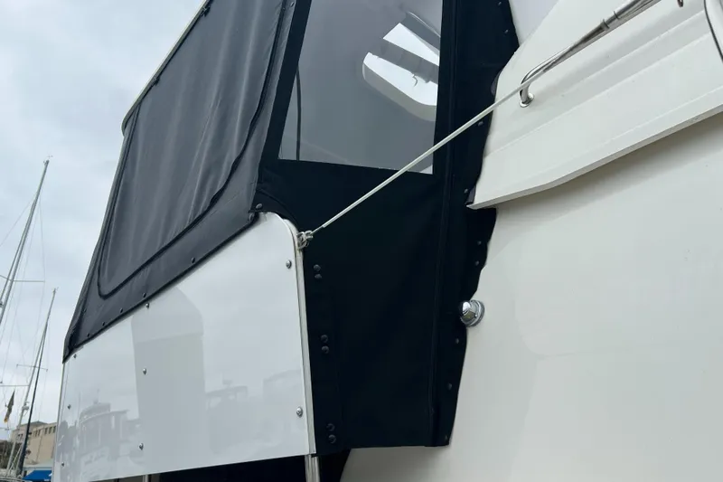 Low Engine Hours Yacht Photos Pics 1995 Cruisers Yachts 3650 ACMY with black canvas enclosure detail.