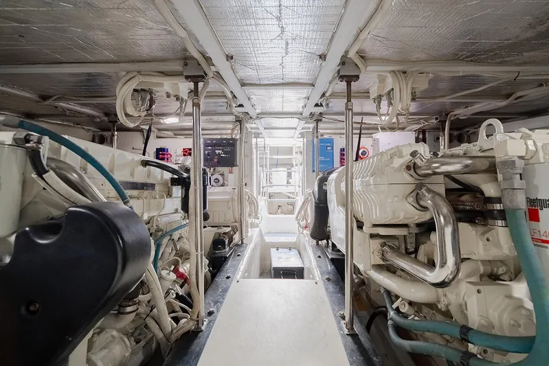 Spencer Yacht Photos Pics Engine room of a 2003 Carver Voyager yacht, showcasing mechanical components and systems.
