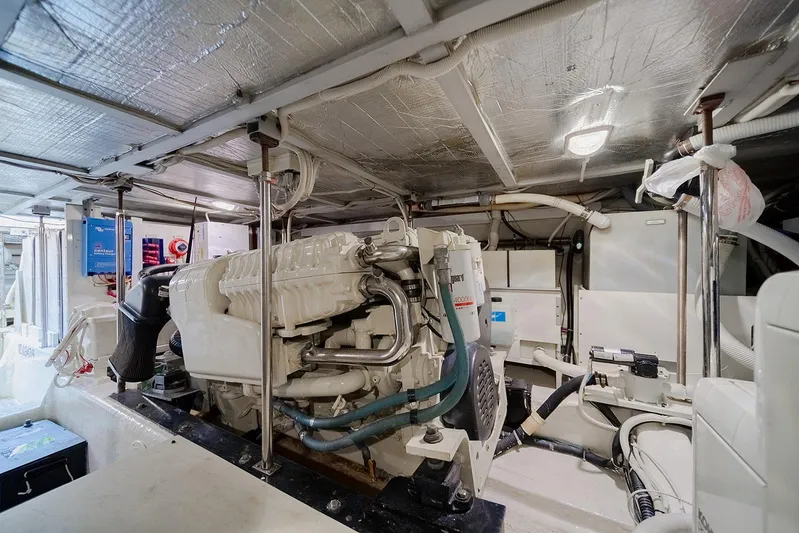 Spencer Yacht Photos Pics Engine room of a 2003 Carver Voyager yacht, showcasing mechanical components and equipment.