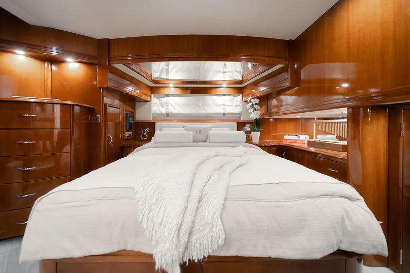 Spencer Yacht Photos Pics Luxurious 2003 Carver Voyager yacht bedroom with elegant wood paneling and cozy bedding.