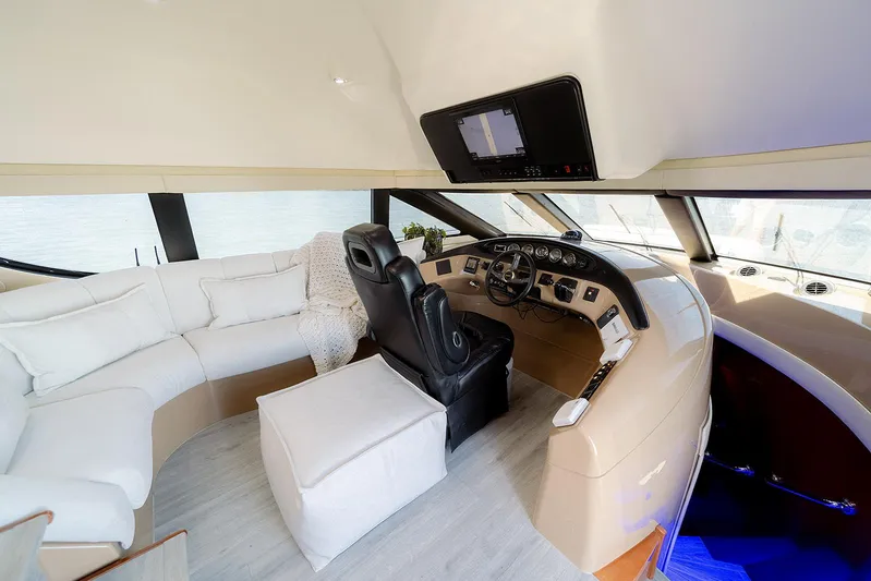 Spencer Yacht Photos Pics Luxurious interior of a 2003 Carver Voyager yacht with plush seating and modern helm.