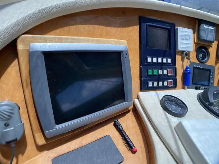 85 Azimut Ultimate Yacht Photos Pics Control panel of a 1999 Azimut 85 Ultimate yacht with navigation equipment.