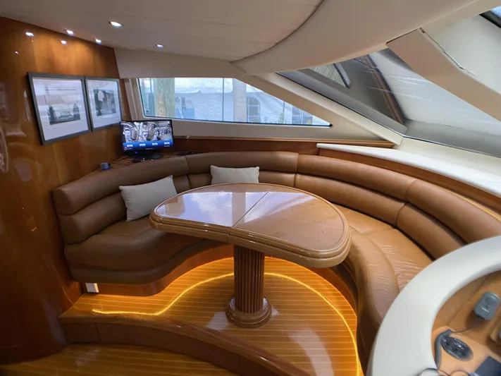 85 Azimut Ultimate Yacht Photos Pics Luxurious interior of 1999 Azimut 85 Ultimate yacht with elegant seating and wooden table.