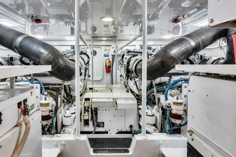 Berry Blessed Yacht Photos Pics Engine room of 2005 Viking 74' Enclosed Bridge yacht, showcasing machinery and equipment.