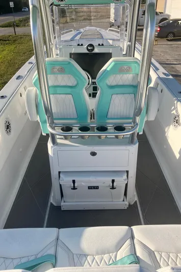  Yacht Photos Pics 2024 Dynamic D-305V boat interior with teal seats and modern console design.