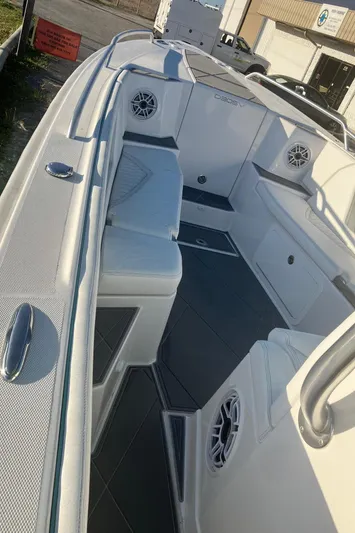  Yacht Photos Pics 2024 Dynamic D-305V boat interior with seating and speakers, showcasing modern design and comfort.