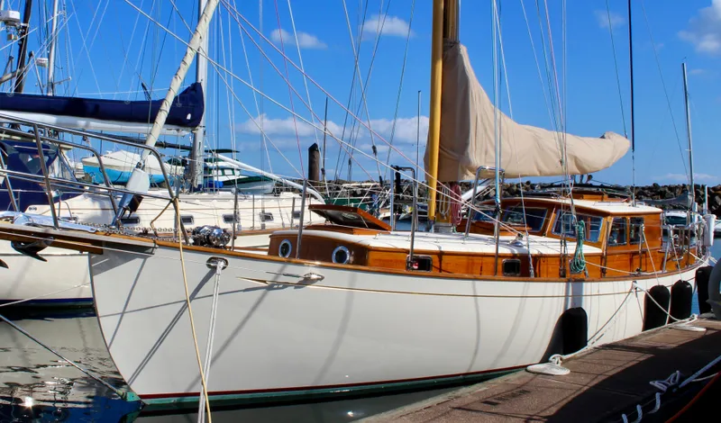 Robert Lewis Yacht Photos Pics 2018 Cape George 45 sailboat docked at marina under clear blue sky.