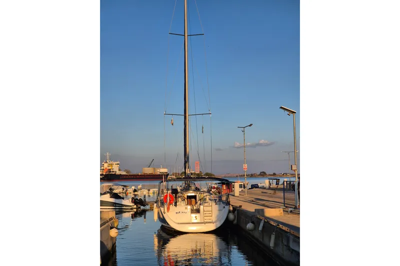 Pac Man Yacht Photos Pics Beneteau Oceanis Clipper 473 yacht docked at sunset, 2001 model.