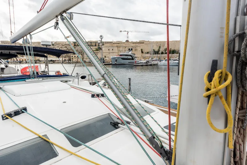 Pac Man Yacht Photos Pics Beneteau Oceanis Clipper 473 sailboat docked in a marina, 2001 model.