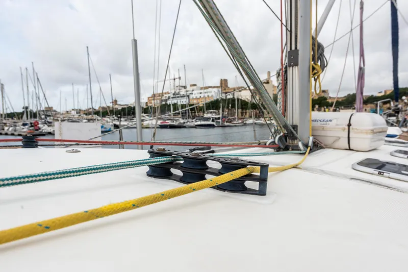 Pac Man Yacht Photos Pics Beneteau Oceanis Clipper 473 sailboat deck with ropes, docked in a marina, 2001 model.