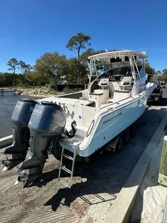  Yacht Photos Pics 2005 Grady-White Marlin 300 boat with twin Yamaha engines on a sunny day.