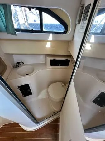  Yacht Photos Pics 2005 Grady-White Marlin 300 boat bathroom interior with sink and toilet.