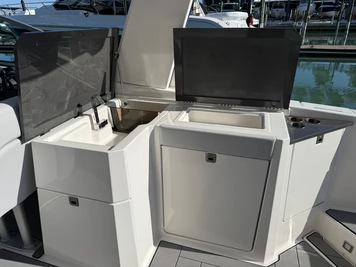 Sea Breeze Yacht Photos Pics Aviara AV32 OB 2022 boat kitchen with sink and storage.
