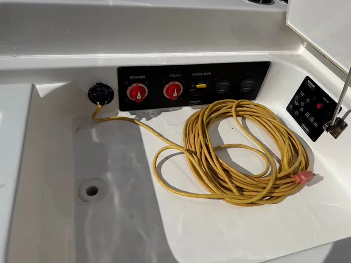 Sea Breeze Yacht Photos Pics Aviara AV32 OB 2022 boat console with cable and switches.