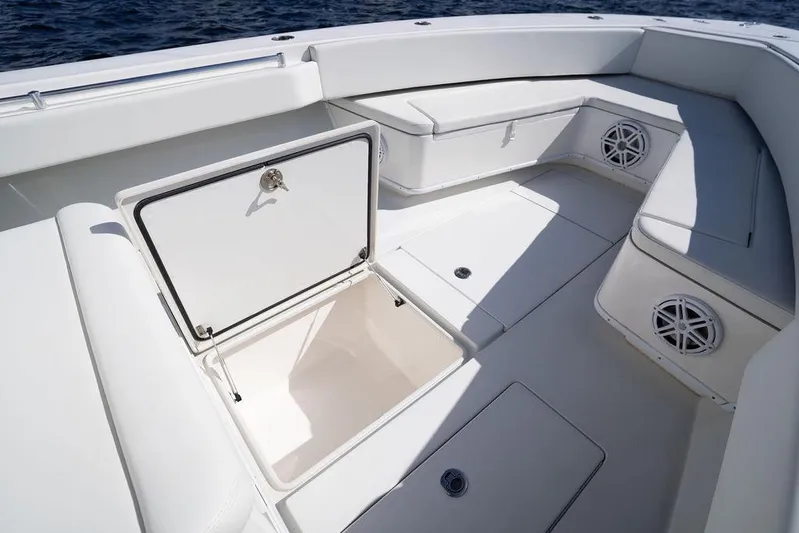  Yacht Photos Pics 2013 Contender 32 ST boat interior with open storage compartment and seating.
