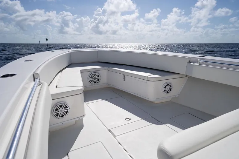  Yacht Photos Pics 2013 Contender 32 ST boat interior with seating, ocean view, and clear sky.