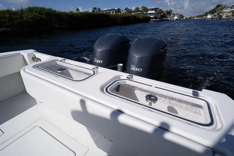  Yacht Photos Pics 2013 Contender 32 ST boat with dual Yamaha 300 engines on a scenic waterway.