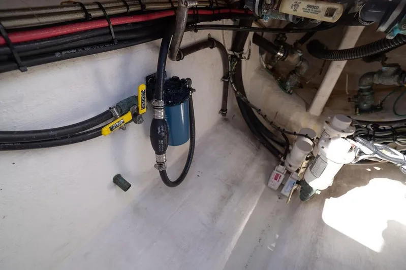  Yacht Photos Pics 2013 Contender 32 ST boat engine compartment with hoses and filters.