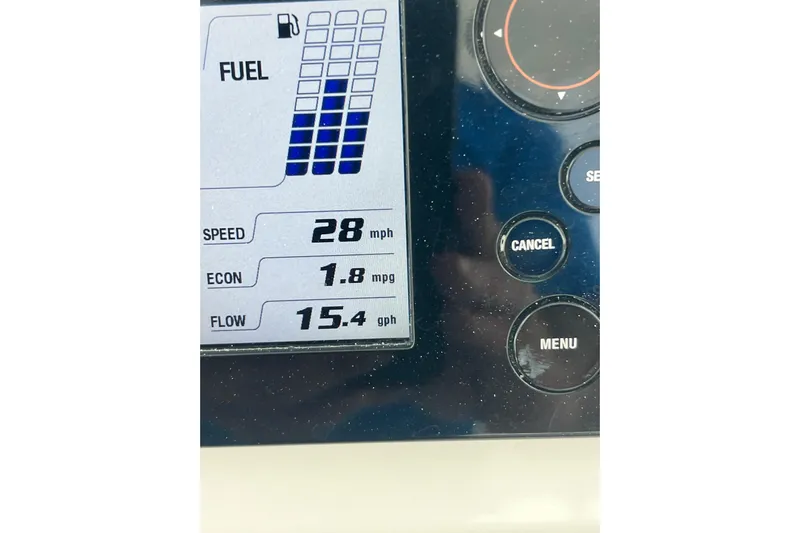  Yacht Photos Pics Dashboard of 2013 Contender 32 ST showing speed, fuel economy, and flow rate.