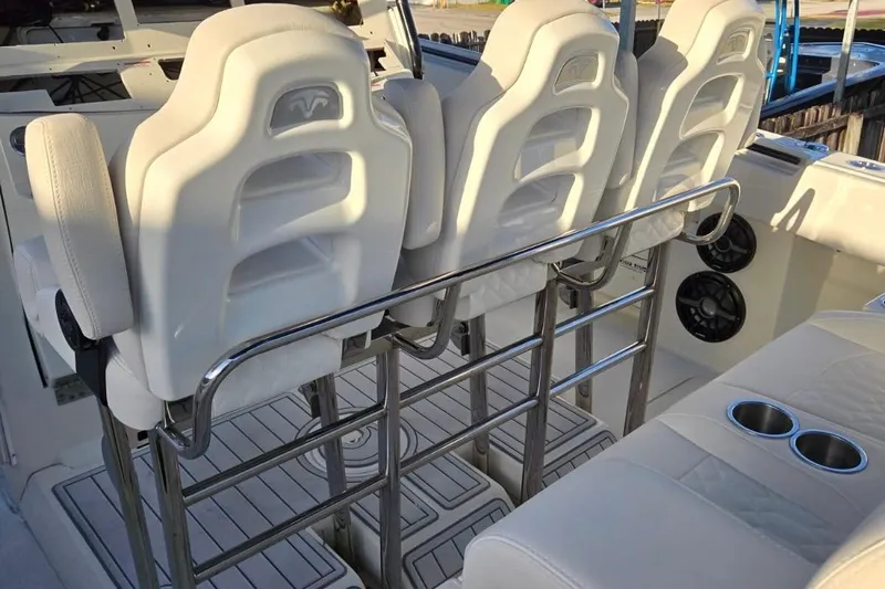  Yacht Photos Pics 2017 HCB 42 Siesta boat interior with white seats and stainless steel railings.