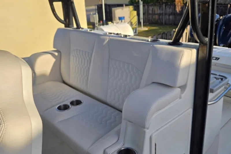  Yacht Photos Pics 2017 HCB 42 Siesta boat interior with cushioned seating and cup holders.