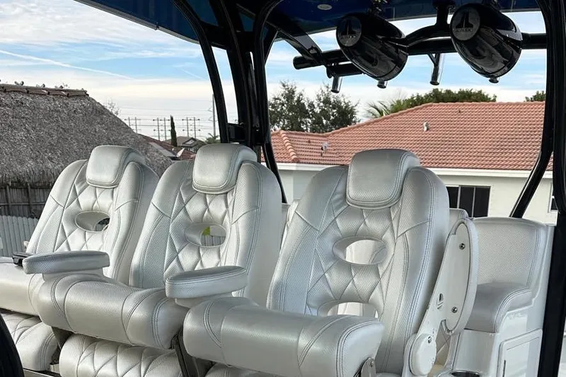  Yacht Photos Pics Luxurious seating on a 2017 Hydra-Sports 4200 Siesta boat, featuring plush white leather chairs.
