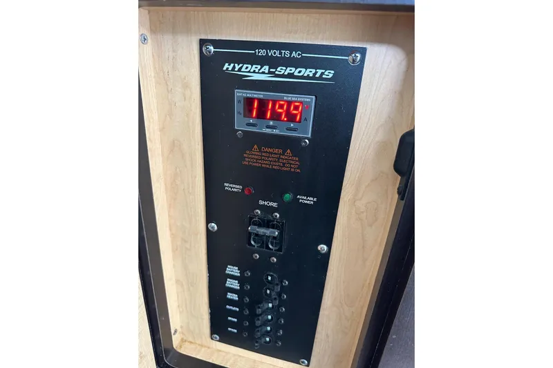  Yacht Photos Pics Control panel of 2017 Hydra-Sports 4200 Siesta boat, displaying voltage and warning indicators.