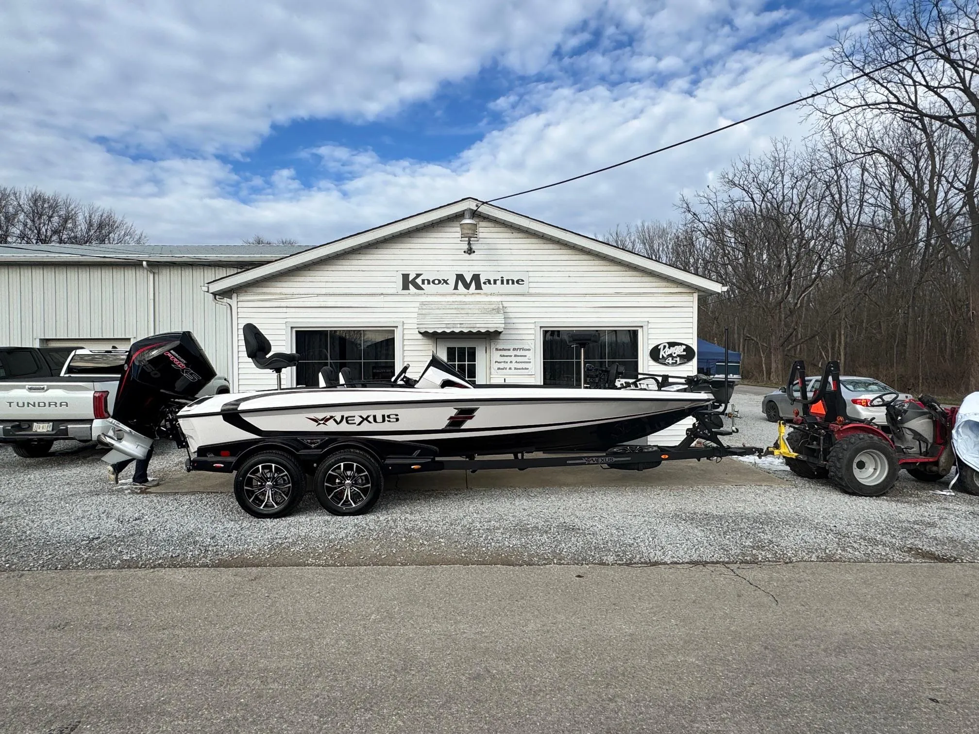 2025 Vexus VXS21 boat parked outside Knox Marine dealership.
