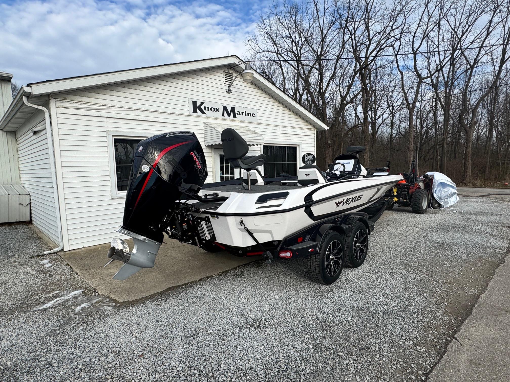 2025 Vexus VXS21 boat parked outside Knox Marine building.