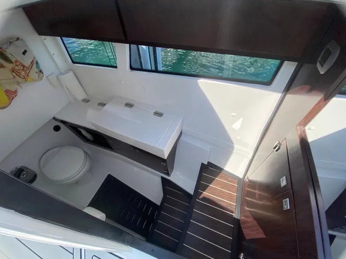  Yacht Photos Pics Interior of 2018 Monterey 385 SE boat bathroom with modern fixtures and wooden accents.
