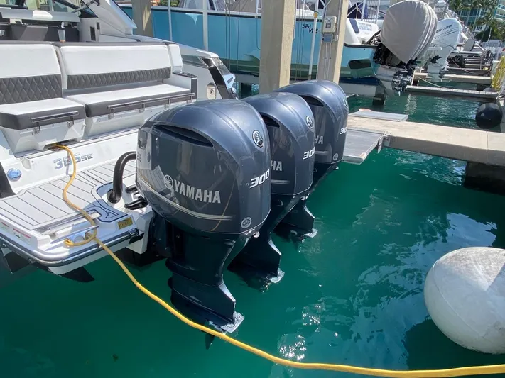  Yacht Photos Pics 2018 Monterey 385 SE boat with triple Yamaha 300 outboard engines docked in marina.