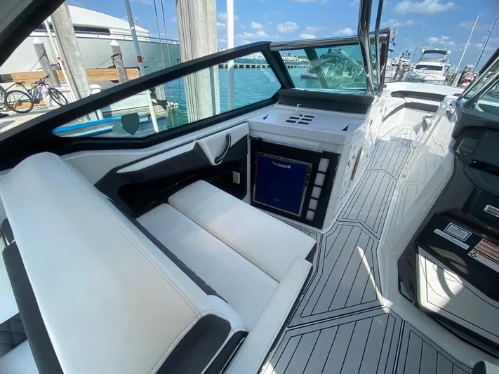  Yacht Photos Pics Luxurious interior of a 2018 Monterey 385 SE boat with sleek seating and modern design.