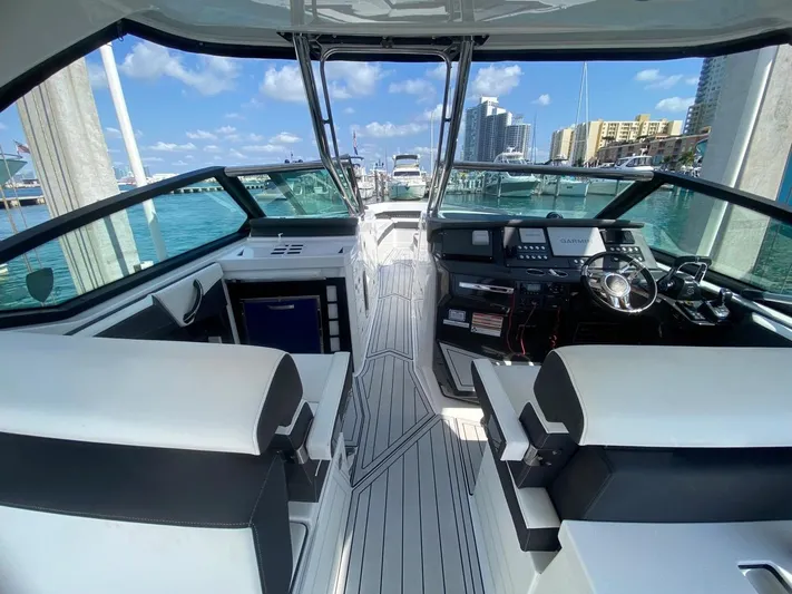  Yacht Photos Pics 2018 Monterey 385 SE boat interior with modern helm, docked at marina.