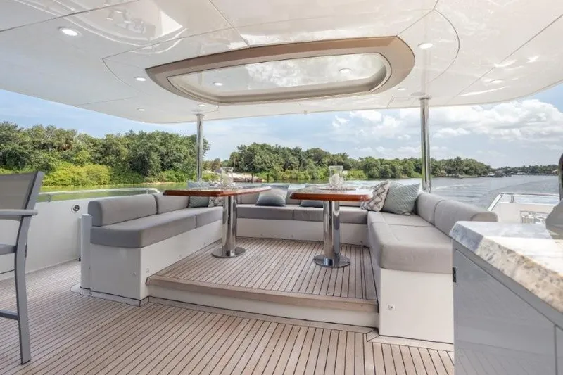 Chindon Yacht Photos Pics Luxurious 2017 Ocean Alexander motor yacht with elegant outdoor seating and scenic water views.