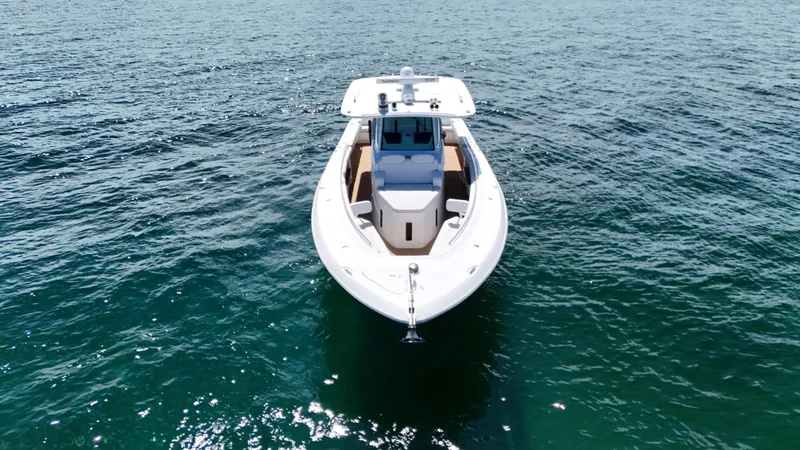  Yacht Photos Pics Front view of 2022 HCB Lujo boat on open water.