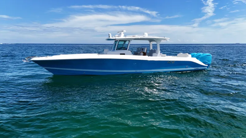  Yacht Photos Pics 2022 HCB Lujo boat on open sea under clear blue sky.