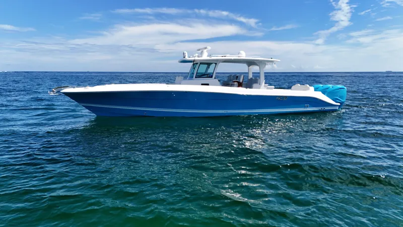  Yacht Photos Pics 2022 HCB Lujo boat on open sea under clear blue sky.