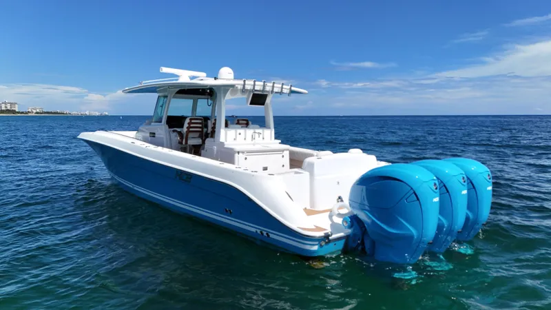  Yacht Photos Pics 2022 HCB Lujo boat with triple outboard engines on open water.