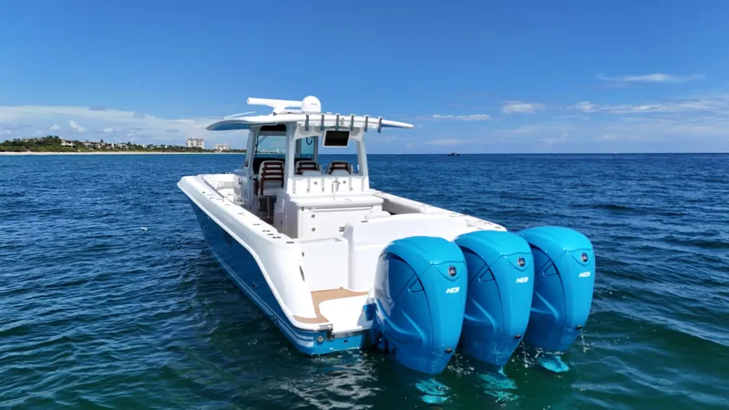  Yacht Photos Pics 2022 HCB Lujo boat with triple outboard engines on open water.