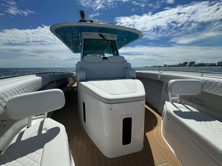  Yacht Photos Pics Luxurious 2022 HCB Lujo boat interior with white seating and ocean view.