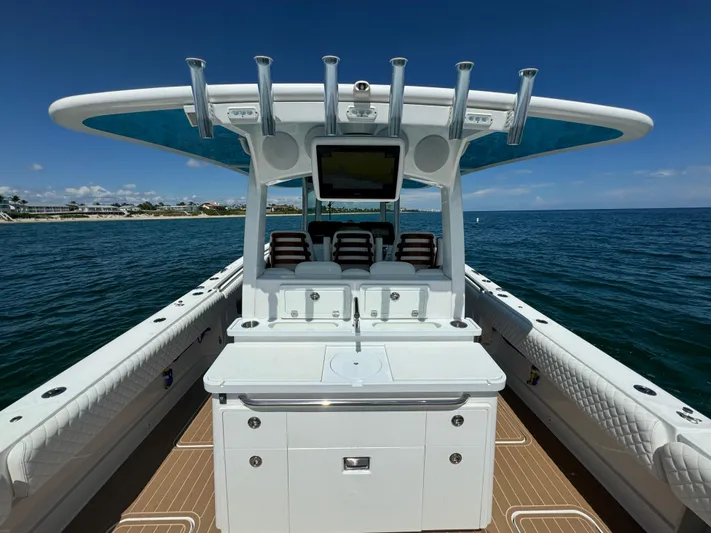  Yacht Photos Pics 2022 HCB Lujo boat interior with fishing rod holders and ocean view.