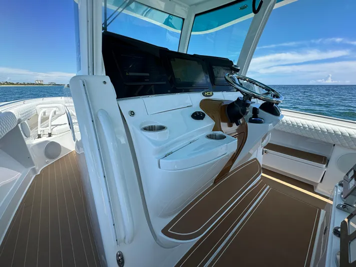  Yacht Photos Pics Luxurious 2022 HCB Lujo boat interior with modern helm and ocean view.