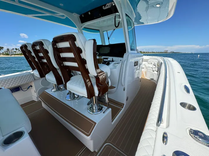  Yacht Photos Pics Luxurious 2022 HCB Lujo boat interior with elegant seating and ocean view.
