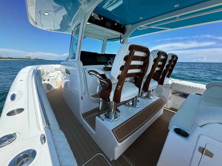  Yacht Photos Pics Luxury 2022 HCB Lujo boat interior with elegant seating and ocean view.