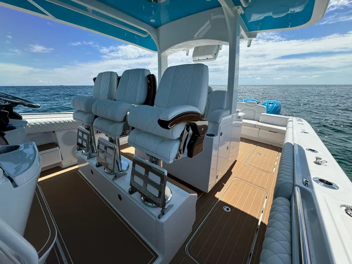  Yacht Photos Pics Luxurious 2022 HCB Lujo boat interior with plush seating and ocean view.